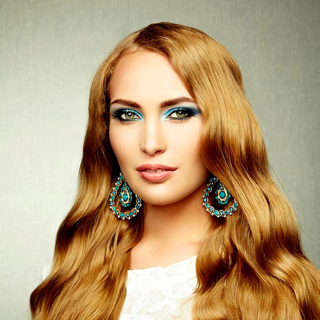 Photo of beautiful woman with magnificent hair. Perfect makeup