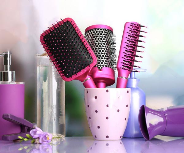 depositphotos_20017953-stock-photo-hair-brushes-hairdryer-straighteners-and